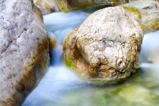 stream is cleared after snow melt in  mountains. Visible elements of water erosion.  waterfall. 