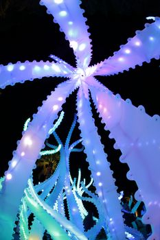 SYDNEY, AUSTRALIA - JUNE 8, 2015;  Looking up at the looming Arclight structures that resemble native mangroves.  Some pieces are large enough to walk between and under and be bathed in their soft light among their twisting stems.