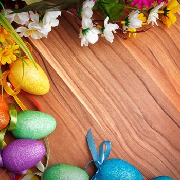 Easter background with colored eggs and flowers