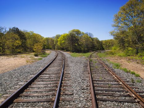 Railroad tracks going either left or right, a concept for choices in life when coming to an intersection