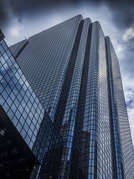 Glass skyscraper building reaching for the sky in perspective