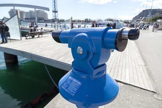 A tourist binocular in the harbor in Barcelona