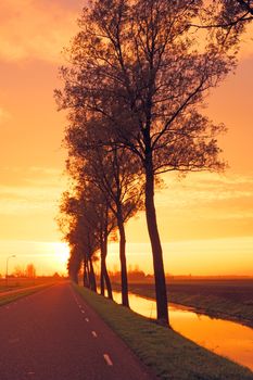 Countryroad in the Netherlands by twilight