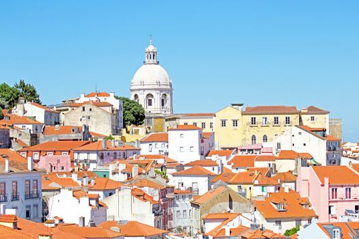 Bird view of central Lisbon with colorful houses and orange roofs