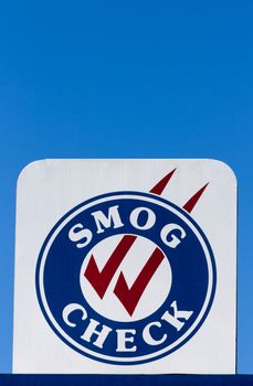 Smog Check sign at automotive repair shop in the United States