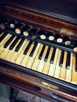 Close-up of antique reed organ (harmonium).