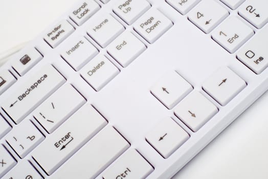 Computer keyboard on isolated white background, close up view