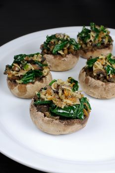 champignons  with vegetable stuffing  spinach and parmesan