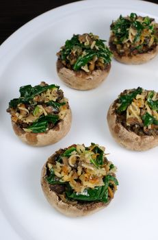 champignons  with vegetable stuffing  spinach and parmesan