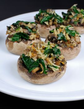 champignons  with vegetable stuffing  spinach and parmesan