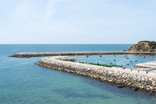 harbour of albufeira with boats in the water of the portugal area algarve