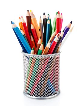 colored pencils in a pencil cup on a white background