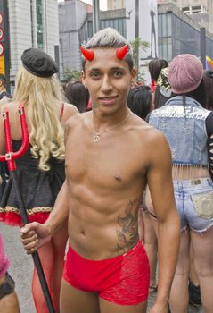 SAO PAULO, BRAZIL - June 7, 2015: An unidentified man  wearing costume and celebrating lesbian, gay, bisexual, and transgender culture in the 19º Pride Parade Sao Paulo.