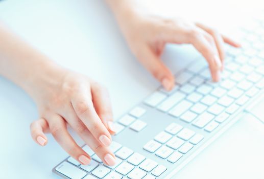 Female hands or woman office worker typing on the keyboard