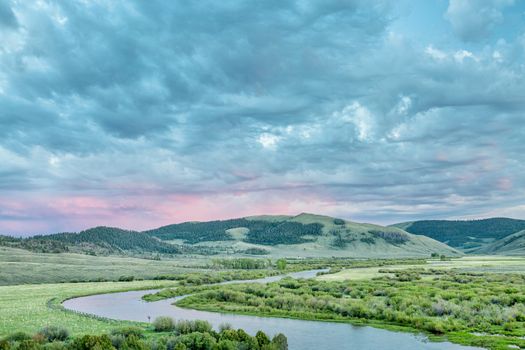 dusk over North Platte River in Colorado North park above Northgate Canyon, early summer scenery with waterfowl