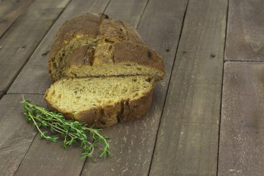 Loaf of wholemeal brown bread cut ready to serve