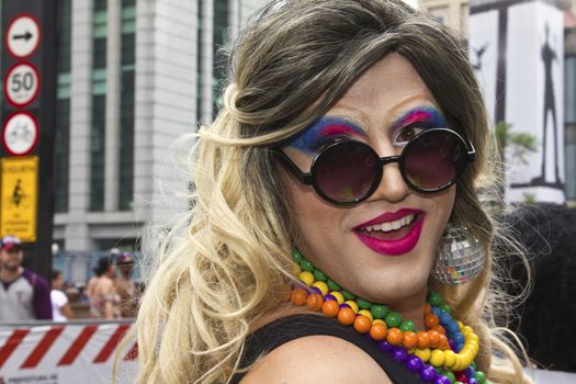 SAO PAULO, BRAZIL - June 7, 2015: An unidentified Drag Queen dressed in traditional costume celebrating lesbian, gay, bisexual, and transgender culture in the 19º Pride Parade Sao Paulo.