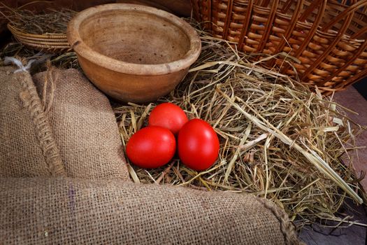 red Easter eggs in the nest