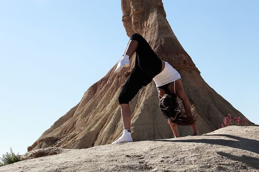 woman doing yoga in the desert