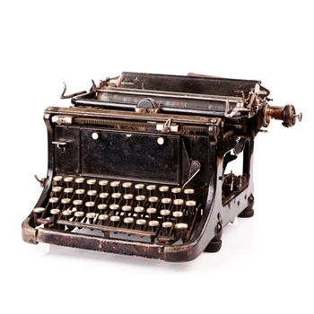 Vintage black typewriter isolated on white background.