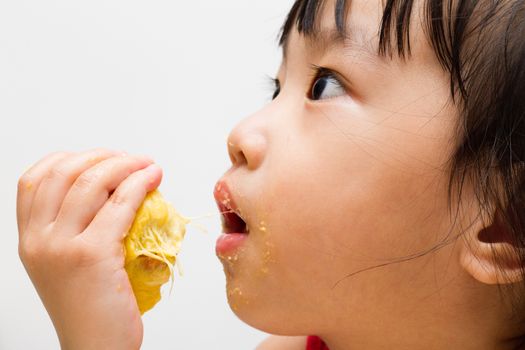Asian Chinese little girl eating durian fruit