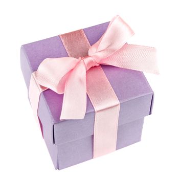 lilac gift box with pink ribbon and bow isolated on white top view