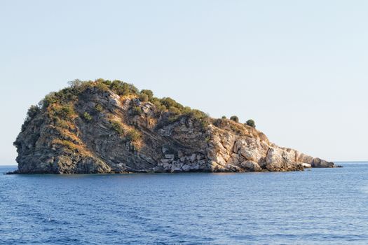 Photo of rock in the blue sea 