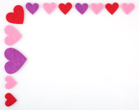 Border of colored hearts  on a white background with space for text