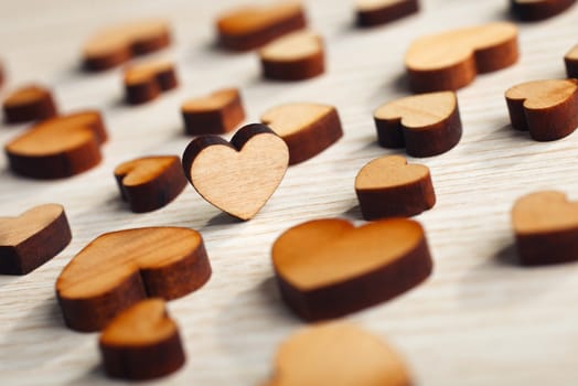 wooden hearts on a light surface