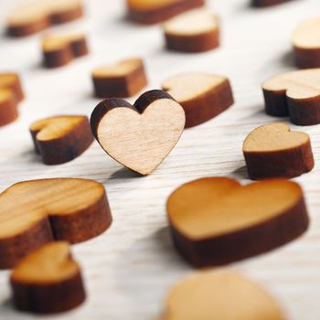 wooden hearts on a light surface