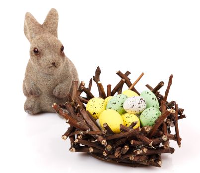 Bunnies with Easter eggs isolated on white background