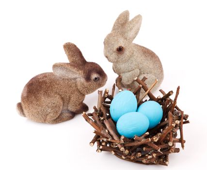 Bunnies with Easter eggs isolated on white background