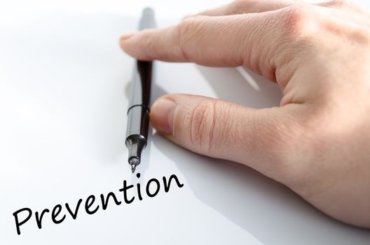 Human hand writing Prevention isolated over white background - business concept