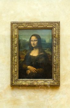 Paris, France - May 13, 2015: Leonardo DaVinci's "Mona Lisa" at the Louvre Museum, May 13, 2015 in Paris, France. The painting is one of the world's most famous.