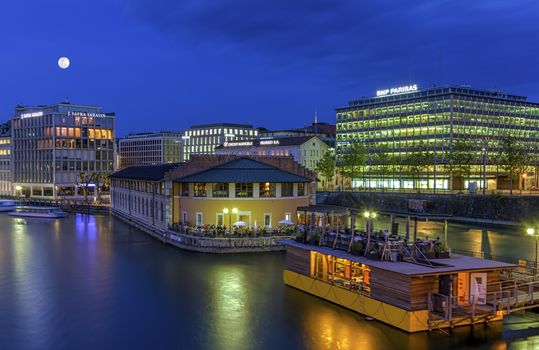 Urban view with bank district by night, Geneva, Switzerland, HDR