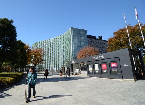 Tokyo, Japan - November 23, 2013: People visit National Art Center in Tokyo, Japan on November 23, 2013. The museum has an exhibition of 600 pieces, concentrating on 20th-century painting and modern arts.