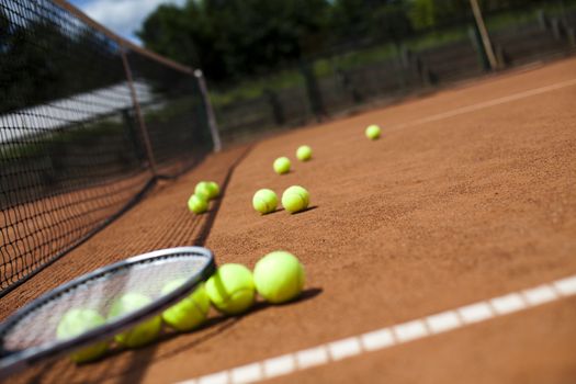 Tennis racket and balls, court