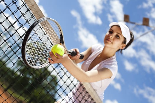 Young woman playing tennis, natural colorful tone