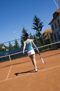 Young woman playing tennis, natural colorful tone