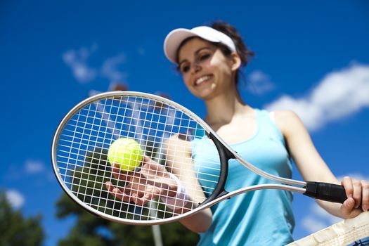 Woman playing tennis, natural colorful tone