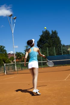 Woman playing tennis, natural colorful tone