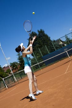 Woman playing tennis, natural colorful tone