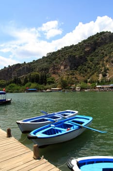 DALYAN, TURKEY - MAY 31, 2015 : Boats for touristic boat trips in the river between Koycegiz Lake and Iztuzu Beach in Dalyan.