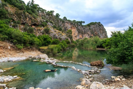 DALYAN, TURKEY - MAY 31, 2015 : Natural thermal lake with sulphur near mudbath pools in Dalyan.