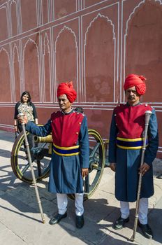 Jaipur, India - December 29, 2014: Two guards in traditional dress at the entrance of the City Palace of Jaipur in Rajashtan, India