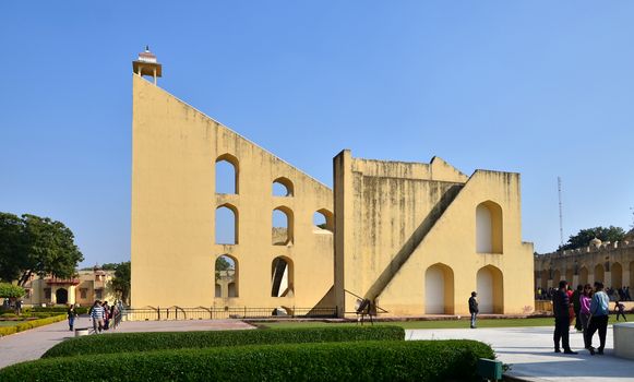 Jaipur, India - December 29, 2014: Tourist visit Jantar Mantar observatory on December 29, 2014 in Jaipur, India. The collection of architectural astronomical instruments, were built by Sawai Jai Singh II in 1727-1734.