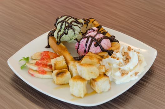 Honey toast and whipping cream with chocolate  sauce and ice cream