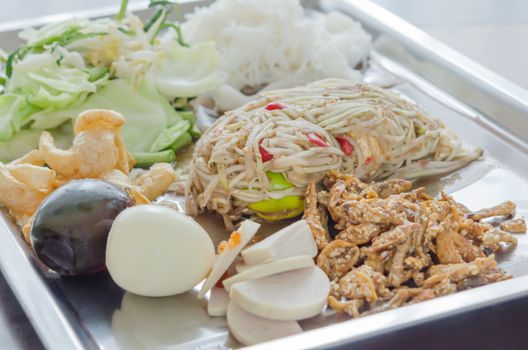 Famous Thai style food, spicy papaya salad