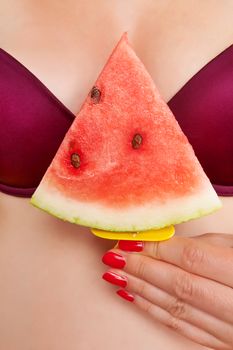 Sexy ice cream eating. Sexy hot woman with red fingernails holding red water melon ice cream between her breast. Sexy summer ice cream eating. Sexy summer.