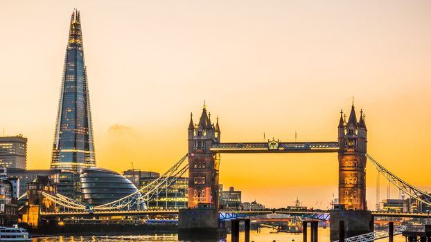 The new London skyline with Tower Bridge and the new The Shard skyscraper at Dusk.